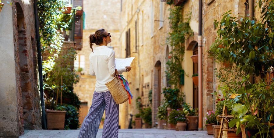 Solo female travelling with map exploring street.jpg