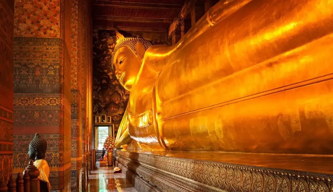 See the reclining Buddha at Wat Pho, Bangkok