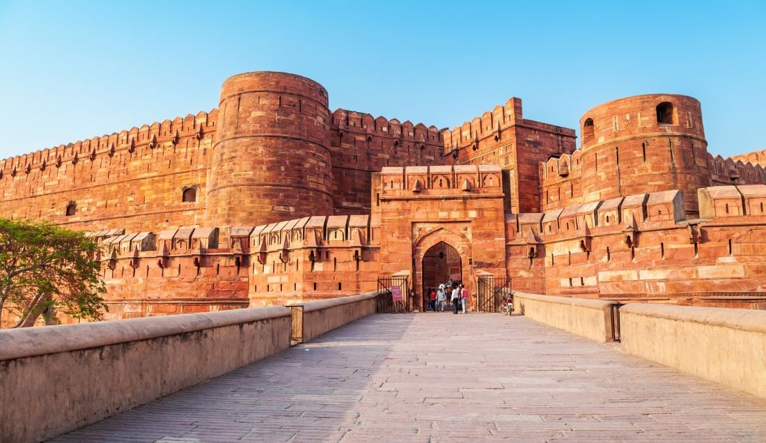 See the impressive red sandstone walls of Agra Fort, a UNESCO World Heritage site.