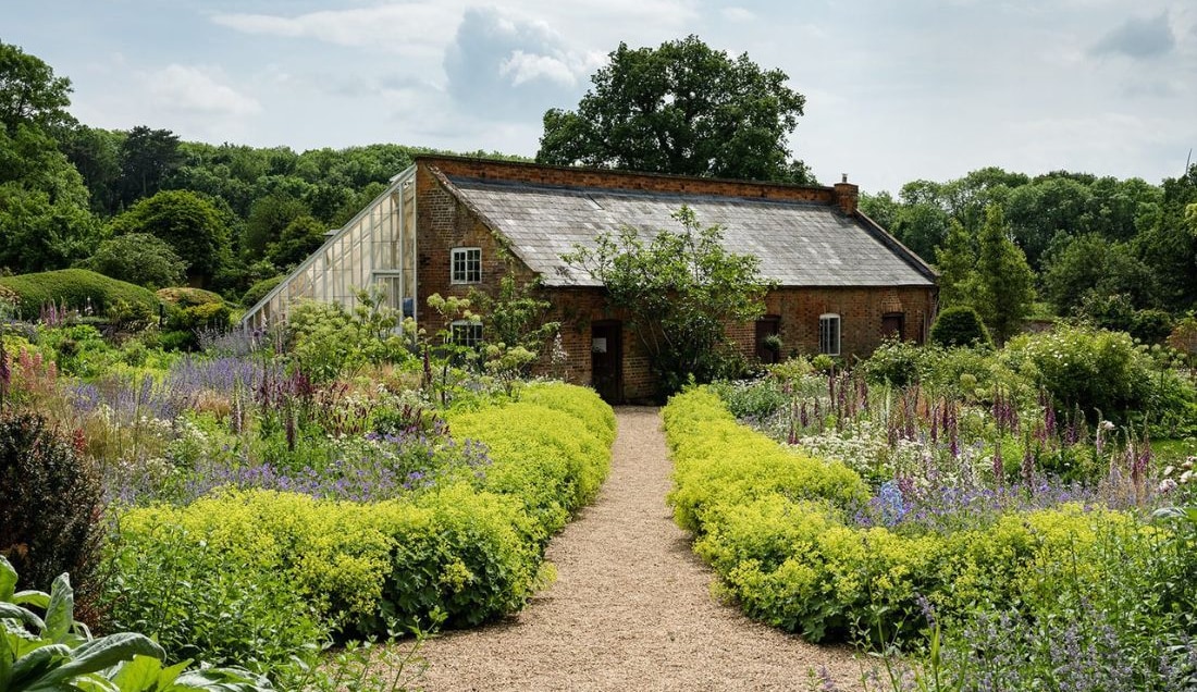 Wander through the charming walled garden at Kelmarsh Hall.