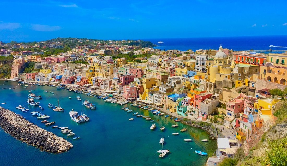 Discover the vibrant charm of Procida with its colourful houses.
