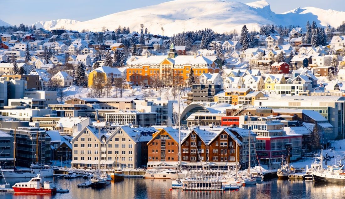 See the colourful houses and boats in Tromso harbour.