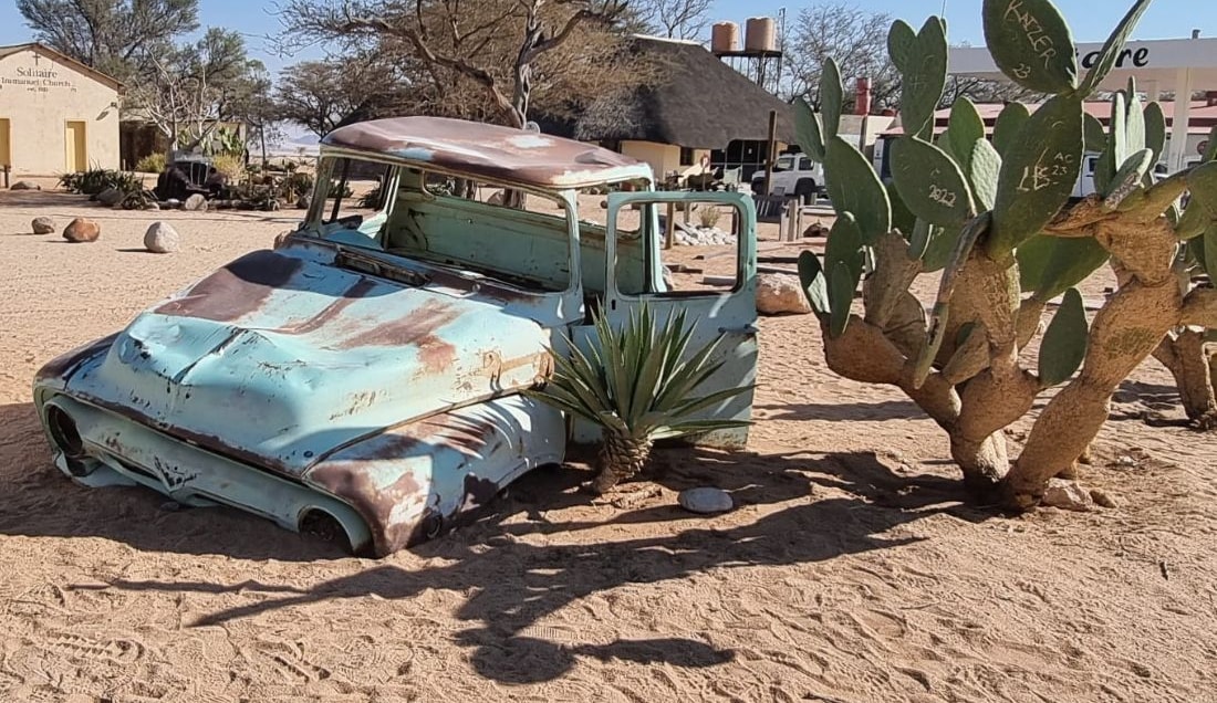 Experience the quirky charm of Solitaire, Namibia, where vintage car relics dot the desert landscape.